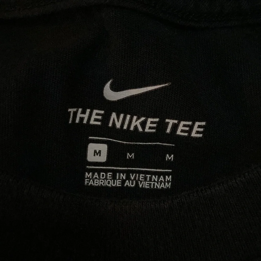 Nike black with purple swoop girls T-shirt Size Medium EUC